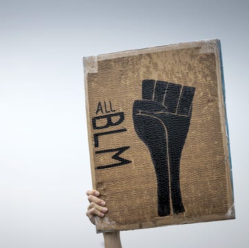 TOPSHOT-NETHERLANDS-POLITICS-POLICE-RACISM-PROTEST topshot a protester holds up a placard reading all blm short for black lives matter during a demonstration in deventer, the netherlands, on june 14, 2020 as part of the worldwide protests against racism and police brutality photo by robin van lonkhuijsen anp afp netherlands out photo by robin van lonkhuijsenanpafp via getty images