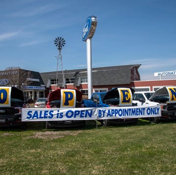 Motor vehicle, Vehicle, Transport, Car, Sky, Advertising, Automotive exterior, Compact car, Truck, Motor vehicle, Vehicle, Transport, Car, Sky, Advertising, Automotive exterior, Compact car, Truck,