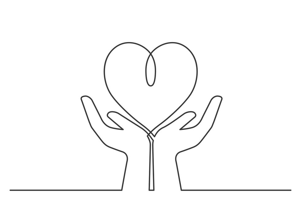 two hands holding a heart