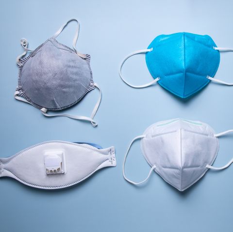 different types of protective face mask against blue background