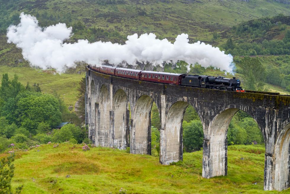 glenfinnan, scotland, united kingdom the jacobite locomotive steam train on west highland rail crosses famous glenfinnan viaduct tourist spot in the highlands of scotland  photo by tim grahamgetty images