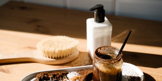 beauty products dry brush scrub on wooden table with beautiful light