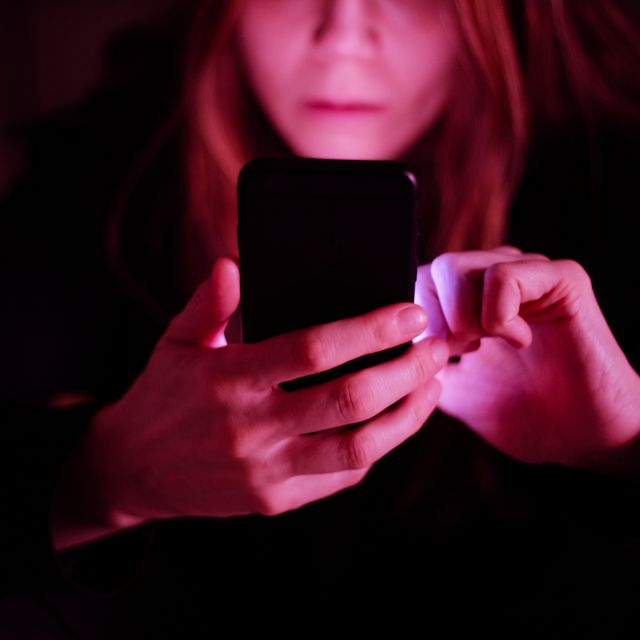 a woman text messaging using cell phones at late hours may cause sleep deprivation and exhaustion smart phone habits are affecting sleep and brains health