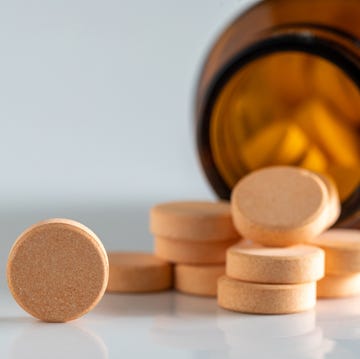 Yellow vitamin pills isolated on a white background yellow vitamin pills isolated on a white background