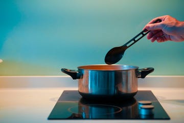 cooking soup in a pan on an induction stove