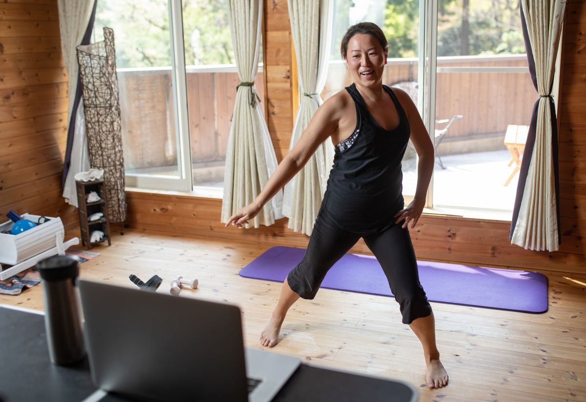 one woman exercising while staying at home