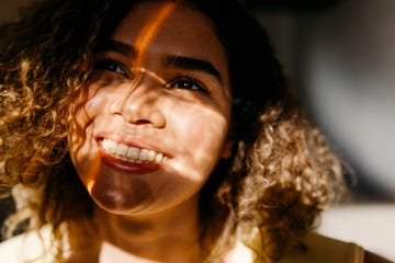 a woman with curly hair