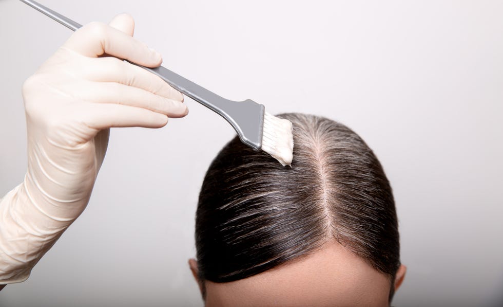 applying hair dye to roots