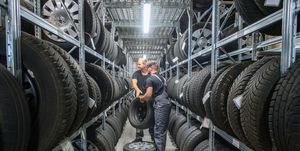 31 july 2020, saxony anhalt, eilsleben rico skiebe l, fourth year apprentice automotive mechatronics technician and his brother justin skiebe lifting tyres off the shelves in the tyre warehouse of the eilsleben car dealership justin skiebe will start an apprenticeship as a car mechatronics technician there on 01 august 2020 in the magdeburg district of the chamber of crafts, a good 820 apprentices will start training in the craft on august 1 that is a good ten percent less than a year ago, the chamber of trade announced photo klaus dietmar gabbertdpa zentralbilddpa photo by klaus dietmar gabbertpicture alliance via getty images