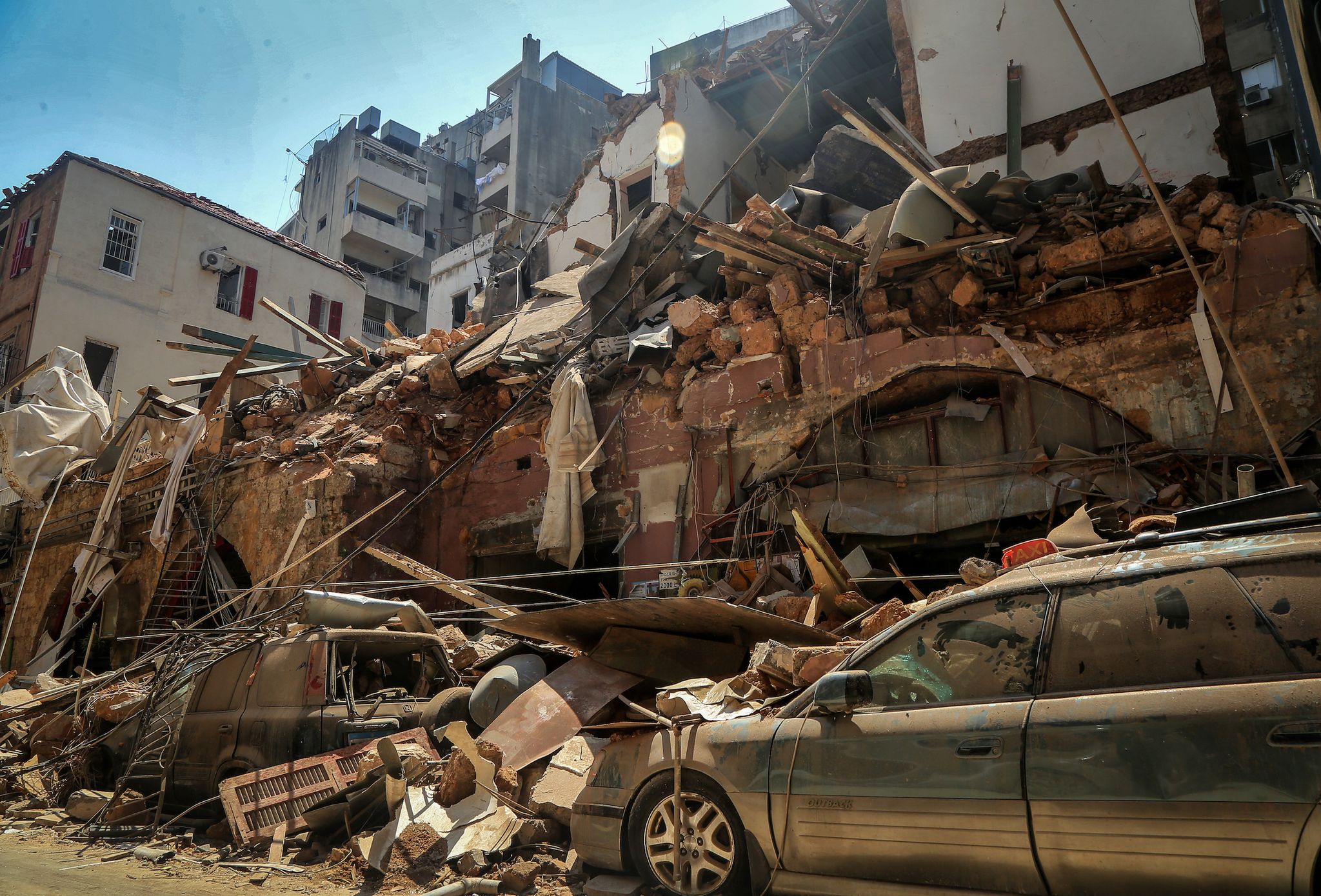 05 august 2020, lebanon, beirut cars are seen under the rubble of a destroyed house a day after a massive explosion in beirut's port that rocked the whole city, killing at least 100 people and injured thousands photo marwan naamanidpa photo by marwan naamanipicture alliance via getty images