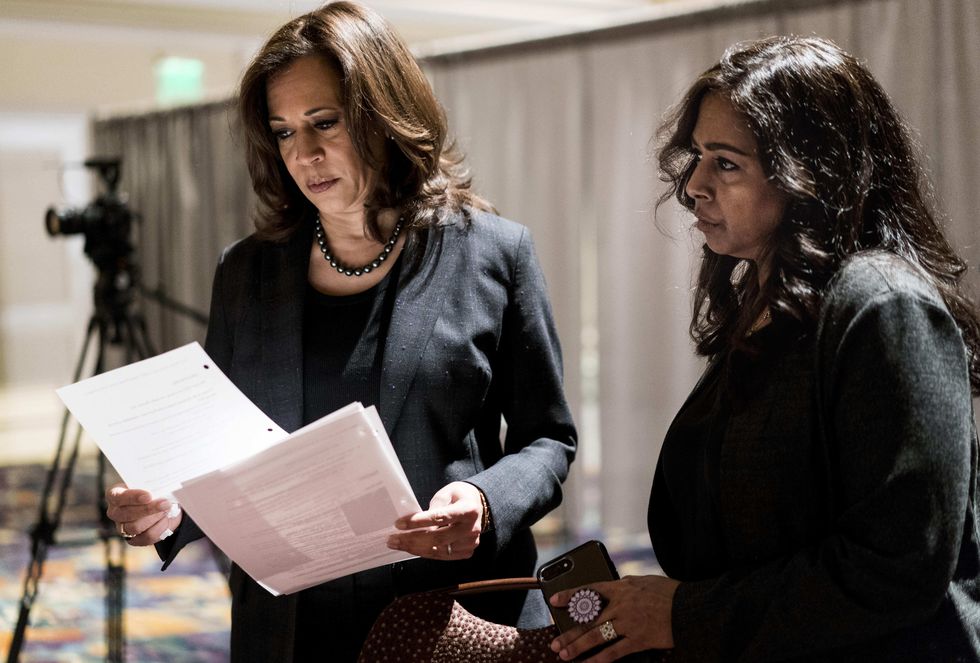 Kamala Harris with sister and advisor, Maya Lakshmi Harris (right), prepares to speak to women of color in a packed banquet room during the Black Enterprise Women of Power Summit at The Mirage in Las Vegas, Nevada on March 1, 2019