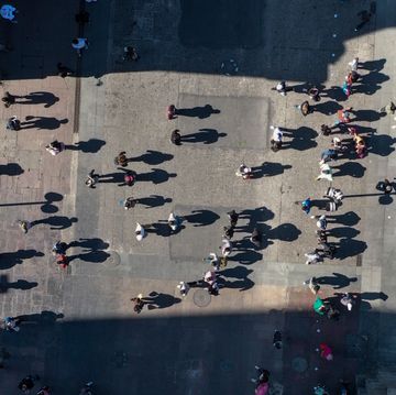 aerial picture showing people walking across the plaza de armas square in santiago, on august 17, 2020 as lockdown measures against the spread of the novel coronavirus, covid 19, ease   santiago resumed its activities on monday after the end of the quarantine that lasted for almost five months, one of the longest in the world, with lines in businesses, physical distancing and some agglomerations photo by martin bernetti  afp photo by martin bernettiafp via getty images