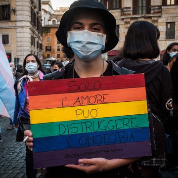 protesters with lgbt pride flags gather during the demonstration at the pantheon, rome, italy on october 17, 2020  against homotransphobia and misogyny to ask that the zan bill, against discrimination on grounds of sexual orientation, be approved as soon as possible photo by andrea ronchininurphoto via getty images
