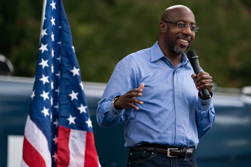 democratic senate candidate reverend raphael warnock speaks at a rally on october 24, 2020, in duluth, georgia   neighbors and volunteers are handing out water and snacks to the masked voters waiting patiently in line to cast their ballots on a hot october day in the atlanta suburb of smyrna
americans go to the polls on november 3 but the enthusiastic early voting here has already given the morning an air of election day
georgia has been a reliably republican, conservative bastion and a democrat has not won in the peach state since bill clinton, a fellow southerner, in 1992
but democratic candidate joe biden, 77, and republican incumbent donald trump, 74, are running neck and neck in the polls in georgia photo by elijah nouvelage  afp photo by elijah nouvelageafp via getty images