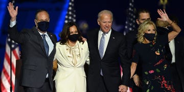 topshot   us president elect joe biden and vice president elect kamala harris stand with spouses jill biden and doug emhoff after delivering remarks in wilmington, delaware, on november 7, 2020, after being declared the winners of the presidential election photo by jim watson  afp photo by jim watsonafp via getty images