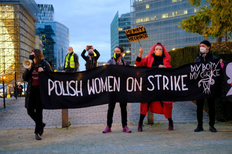 brussels, belgium   november 11 polish, mainly women, demonstrate in front of the berlaymont, the eu commission headquarter union against the new restriction on abortion law in poland on november 11, 2020 in brussels, belgium polands top court has ruled that abortions in cases of foetal defects are unconstitutional polands abortion laws were already among the strictest in europe but the constitutional tribunals ruling will mean an almost total ban once the decision comes into effect, terminations will only be allowed in cases of rape or incest, or if the mothers health is at risk photo by thierry monassegetty images