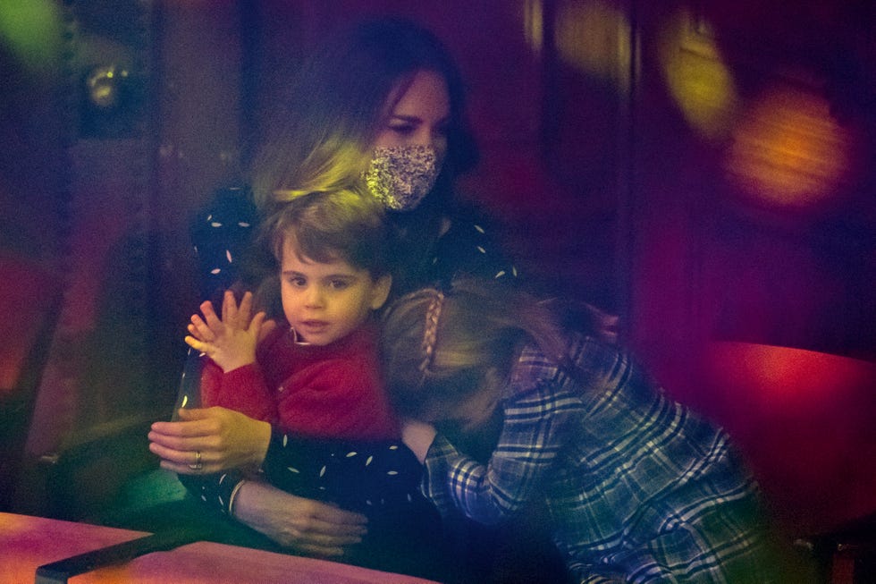 london, england   december 11 catherine, duchess of cambridge, prince louis and princess charlotte attend a special pantomime performance at londons palladium theatre, hosted by the national lottery, to thank key workers and their families for their efforts throughout the pandemic on december 11, 2020 in london, england photo by  aaron chown   wpa poolgetty images