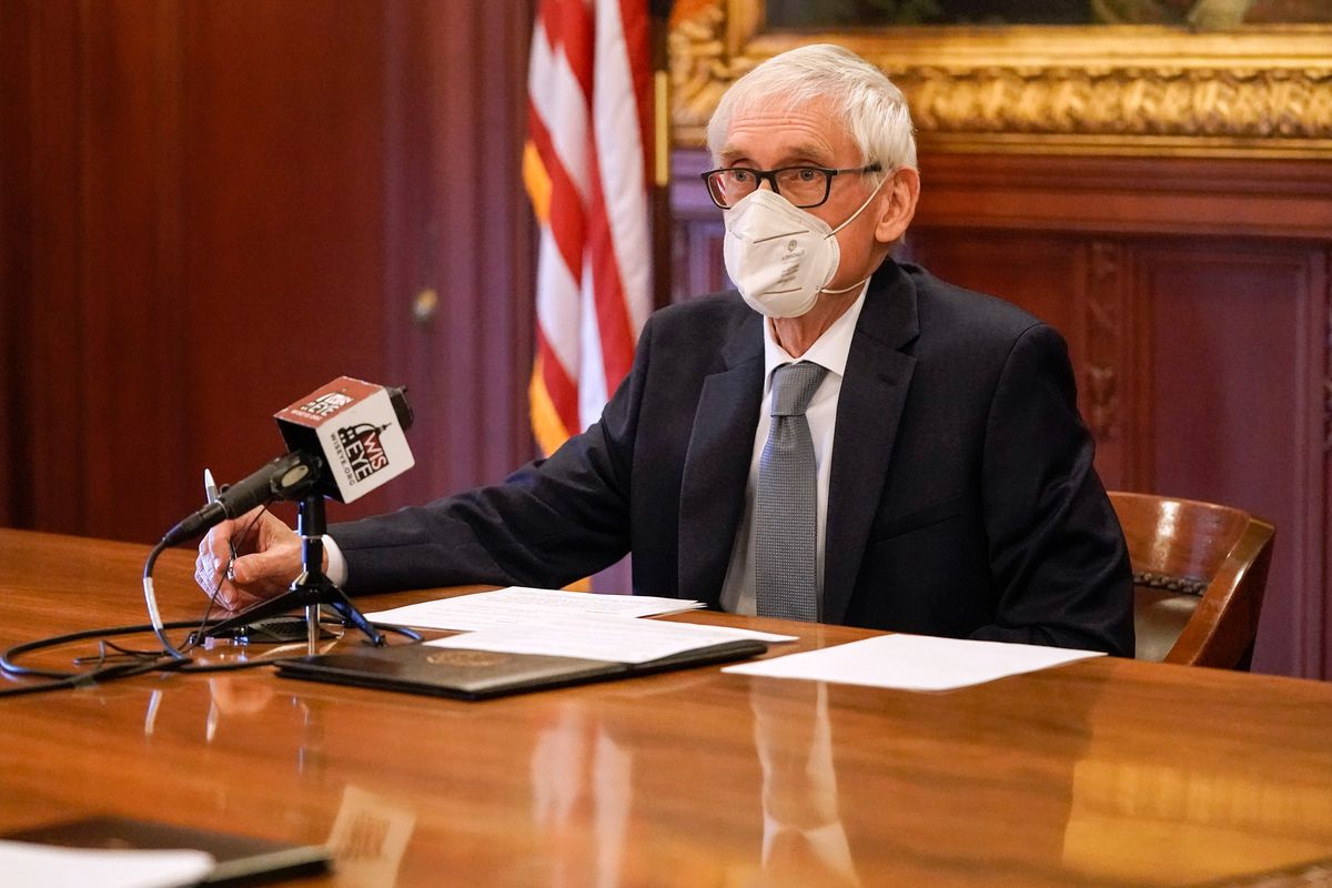 madison, wisconsin   december 14 wisconsin gov tony evers, a member of wisconsin's electoral college, casts his vote for the presidential election at the state capitol on december 14, 2020 in madison, wisconsin photo by morry gash poolgetty images