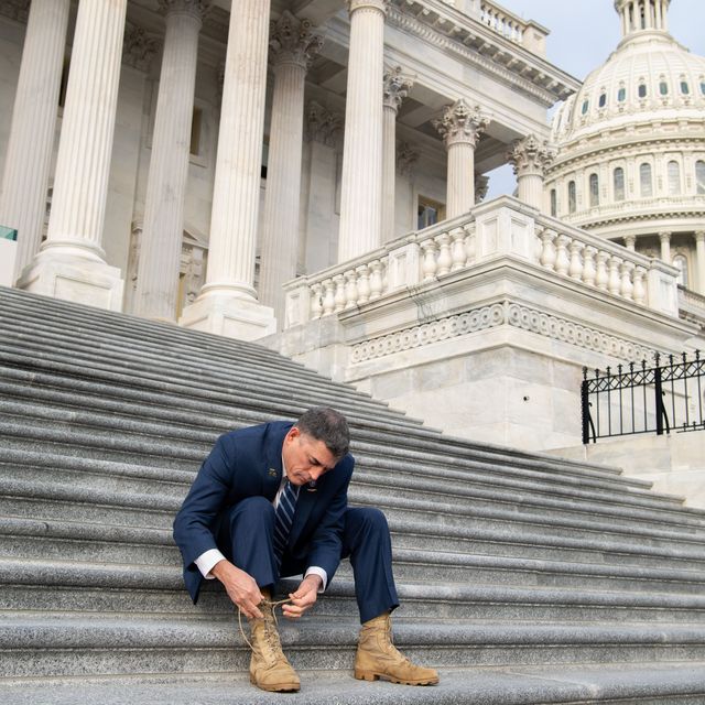 us representative andrew clyde, republican of georgia, ties his combat boots following a photograph with first term republican members of congress on the steps of the us capitol in washington, dc, january 4, 2021   donald trump and joe biden head to georgia on monday to rally their party faithful ahead of twin runoffs that will decide who controls the us senate, one day after the release of a bombshell recording of the outgoing president that rocked washingtonif democratic challengers defeat the republican incumbents in both races tuesday, the split in the upper chamber of congress will be 50 50, meaning incoming vice president kamala harris will have the deciding vote photo by saul loeb  afp photo by saul loebafp via getty images