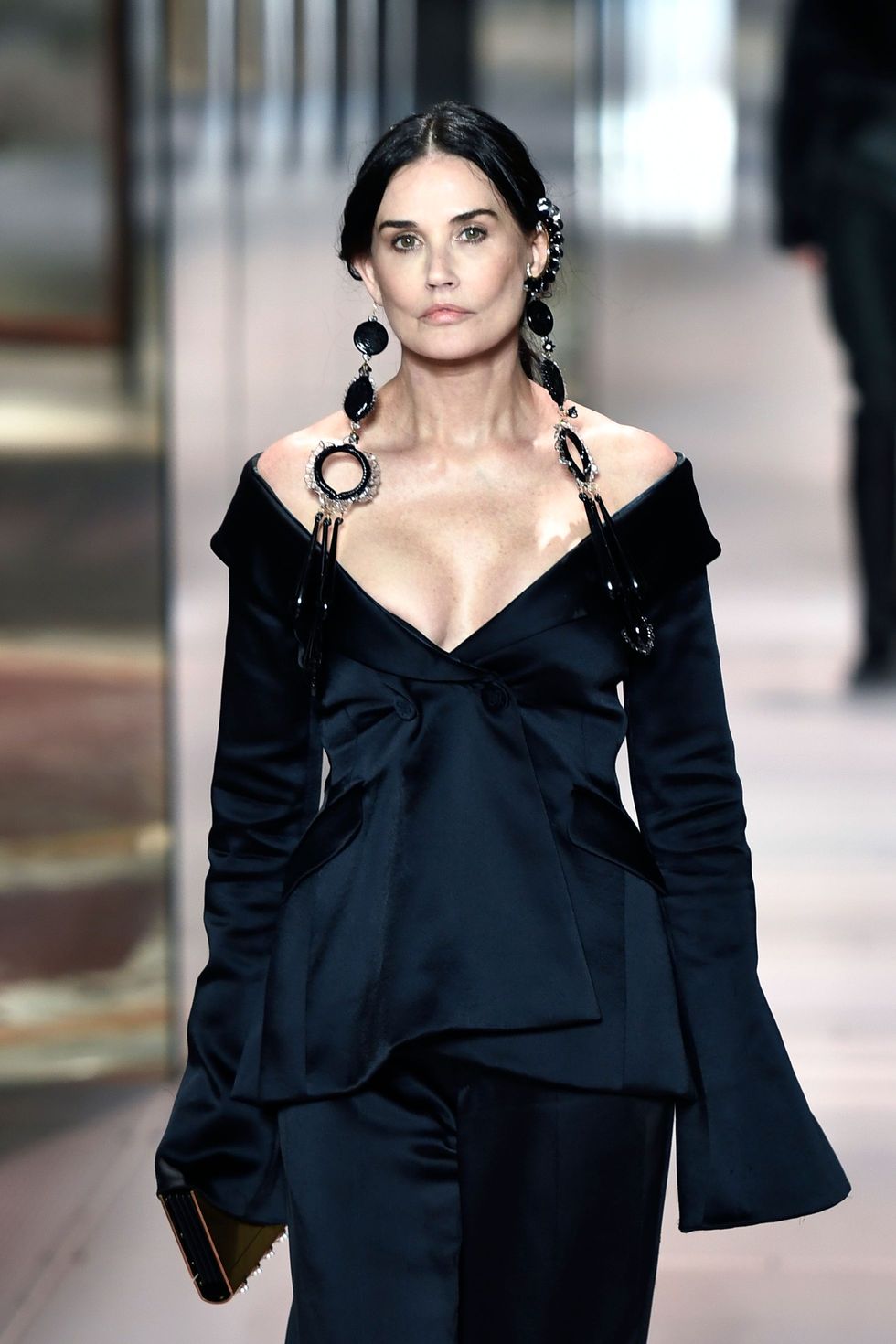 us actress demi moore presents a creation of british designer kim jones for the fendis spring summer 2021 collection during the paris haute couture fashion week, in paris, on january 27, 2021   british designer kim jones presents his first ever couture collection for fendi since he joinded italian fashion house fendi as its lead designer for womenswear in september 2020 photo by stephane de sakutin  afp photo by stephane de sakutinafp via getty images