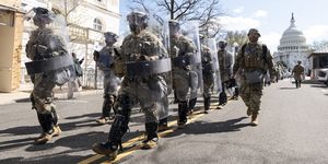 united states   april 2 national guard troops in riot gear leave the scene as capitol police investigate the scene after a vehicle drove into a security barrier near the us capitol building on friday april 2, 2021 photo by bill clarkcq roll call, inc via getty images