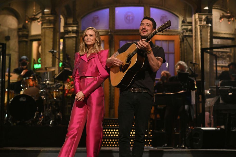 saturday night live carey mulligan episode 1802 pictured l r host carey mulligan with her husband marcus mumford during the monologue on saturday, april 10, 2021 photo by will heathnbcnbcu photo bank via getty images