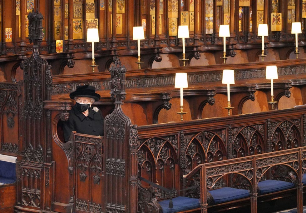 queen elizabeth ii takes her seat for the funeral service of britains prince philip, duke of edinburgh inside st georges chapel in windsor castle in windsor, west of london, on april 17, 2021   philip, who was married to queen elizabeth ii for 73 years, died on april 9 aged 99 just weeks after a month long stay in hospital for treatment to a heart condition and an infection photo by jonathan brady  pool  afp photo by jonathan bradypoolafp via getty images