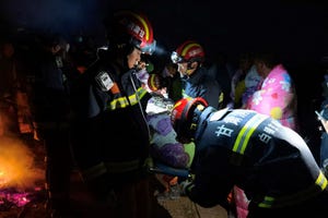 this photo taken on may 22, 2021 shows rescuers assisting people who were competing in a 100 kilometre cross country mountain race when extreme weather hit the area, leaving at least 20 dead, near the city of baiyin in chinas northwestern gansu province china out photo by str afp china out photo by strafp via getty images