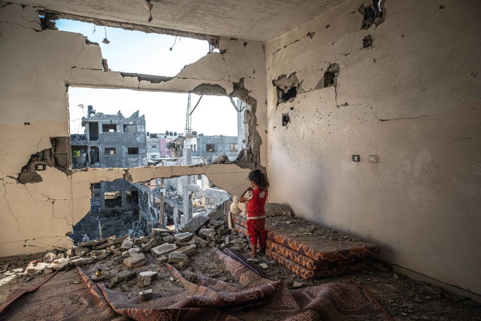 beit hanoun, gaza may 24 a palestinian girl stands amid the rubble of her destroyed home on may 24, 2021 in beit hanoun, gaza gaza residents continue clean up operations as they return to damaged and destroyed homes as the ceasefire between israel and hamas appeared to be holding into a fourth day the ceasefire brings to an end 11 days of fighting which left dead more than 250 palestinians many of them women and children and 13 israelis the conflict began on may 10 after rising tensions in east jerusalem and clashes at the al aqsa mosque compound photo by fatima shbairgetty images