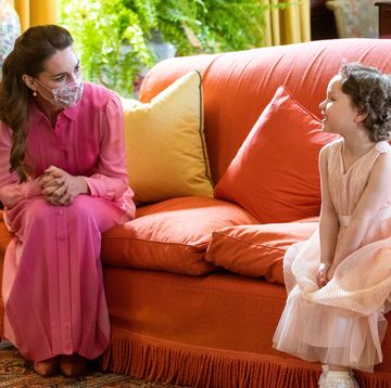 britains catherine, duchess of cambridge l meets five year old mila sneddon, a cancer patient who featured in an image from the hold still photography project which showed her kissing her father scott through a window whilst she was shielding during her chemotherapy treatment, at the palace of holyroodhouse in edinburgh, scotland on may 27, 2021 photo by jane barlow pool afp photo by jane barlowpoolafp via getty images