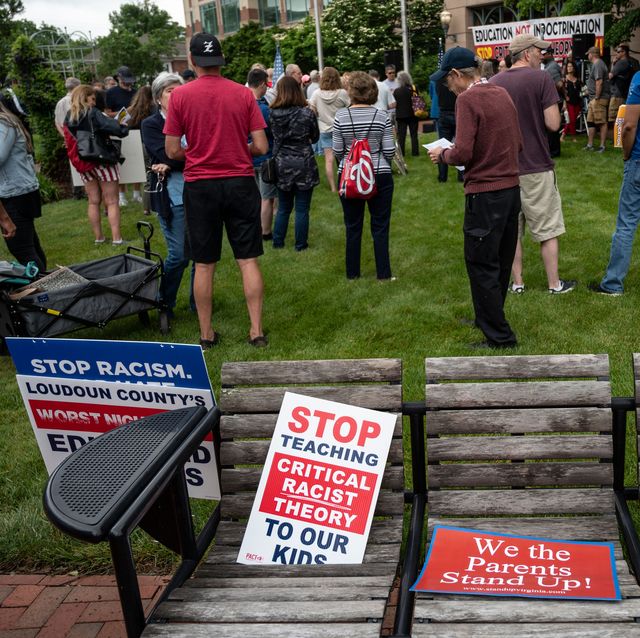 signs are seen on a bench during a rally against critical race theory crt being taught in schools at the loudoun county government center in leesburg, virginia on june 12, 2021   are you ready to take back our schools republican activist patti menders shouted at a rally opposing anti racism teaching that critics like her say trains white children to see themselves as oppressors yes, answered in unison the hundreds of demonstrators gathered this weekend near washington to fight against critical race theory, the latest battleground of americas ongoing culture wars the term critical race theory defines a strand of thought that appeared in american law schools in the late 1970s and which looks at racism as a system, enabled by laws and institutions, rather than at the level of individual prejudices but critics use it as a catch all phrase that attacks teachers efforts to confront dark episodes in american history, including slavery and segregation, as well as to tackle racist stereotypes photo by andrew caballero reynolds  afp photo by andrew caballero reynoldsafp via getty images