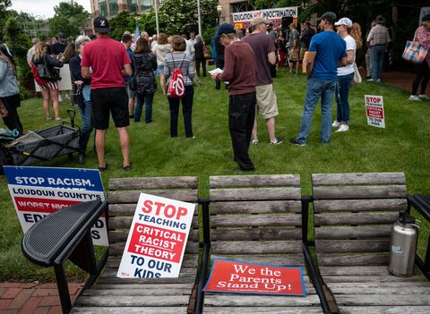 signs are seen on a bench during a rally against critical race theory crt being taught in schools at the loudoun county government center in leesburg, virginia on june 12, 2021   are you ready to take back our schools republican activist patti menders shouted at a rally opposing anti racism teaching that critics like her say trains white children to see themselves as oppressors yes, answered in unison the hundreds of demonstrators gathered this weekend near washington to fight against critical race theory, the latest battleground of americas ongoing culture wars the term critical race theory defines a strand of thought that appeared in american law schools in the late 1970s and which looks at racism as a system, enabled by laws and institutions, rather than at the level of individual prejudices but critics use it as a catch all phrase that attacks teachers efforts to confront dark episodes in american history, including slavery and segregation, as well as to tackle racist stereotypes photo by andrew caballero reynolds  afp photo by andrew caballero reynoldsafp via getty images