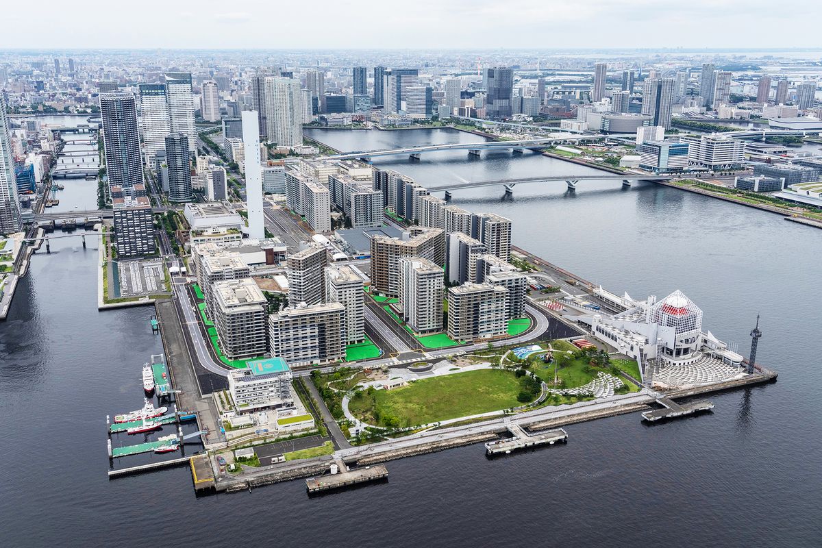 the tokyo olympic village is pictured from a helicopter in june 2021