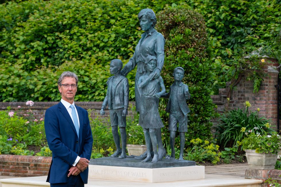 sculptor ian rank broadley poses alongside his statue of diana, princess of wales, unveiled by her sons britains prince william, duke of cambridge and britains prince harry, duke of sussex, at the sunken garden in kensington palace, london on july 1, 2021, which would have been her 60th birthday   the bronze statue depicts the princess surrounded by three children to represent the universality and generational impact of her work her short cropped hair, style of dress and portrait are based on the final period of her life beneath the statue is a plinth engraved with her name and the date of the unveiling, and in front is a paving stone engraved with an extract inspired by the measure of a man poem    restricted to editorial use   mandatory mention of the artist upon publication   to illustrate the event as specified in the caption photo by dominic lipinski  pool  afp  restricted to editorial use   mandatory mention of the artist upon publication   to illustrate the event as specified in the caption  restricted to editorial use   mandatory mention of the artist upon publication   to illustrate the event as specified in the caption photo by dominic lipinskipoolafp via getty images