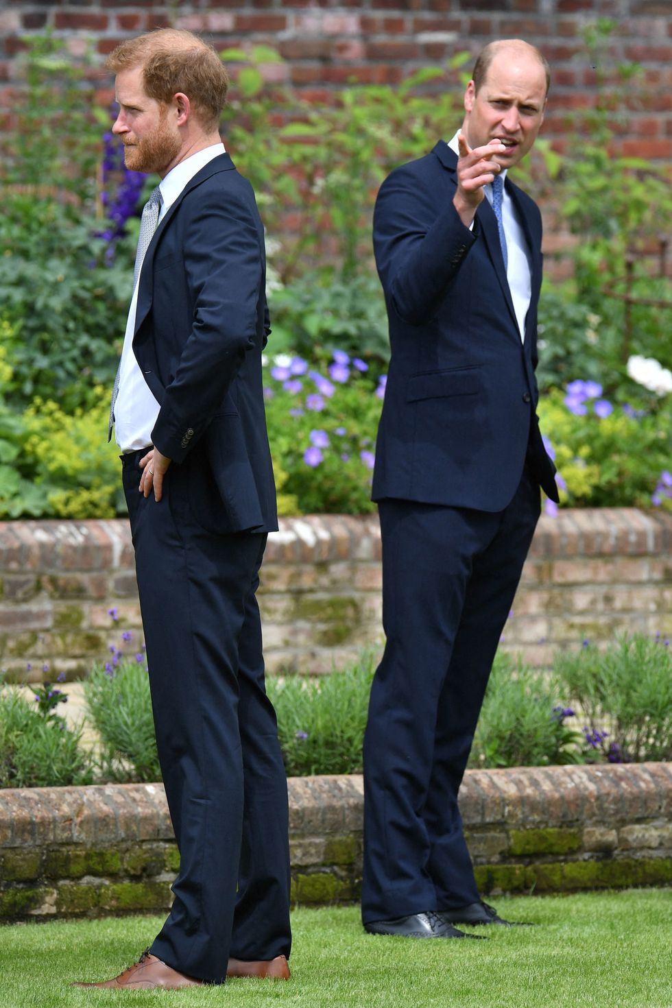 topshot   britains prince harry, duke of sussex l and britains prince william, duke of cambridge attend the unveiling of a statue of their mother, princess diana at the sunken garden in kensington palace, london on july 1, 2021, which would have been her 60th birthday   princes william and harry set aside their differences on thursday to unveil a new statue of their mother, princess diana, on what would have been her 60th birthday photo by dominic lipinski  pool  afp photo by dominic lipinskipoolafp via getty images