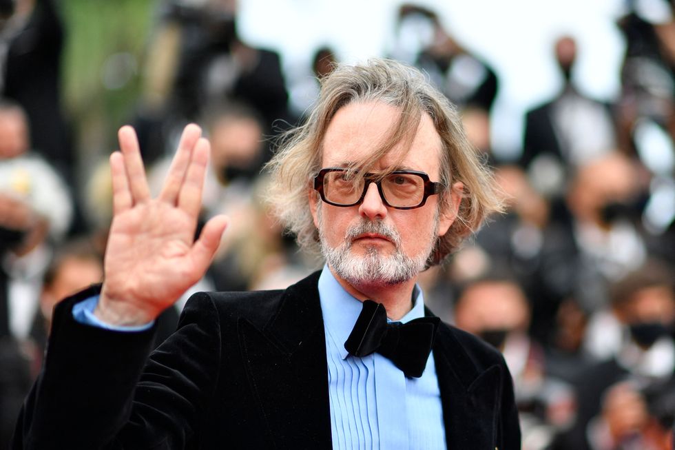 british musician jarvis cocker waves as he arrives for the screening of the film the french dispatch at the 74th edition of the cannes film festival in cannes, southern france, on july 12, 2021 photo by john macdougall  afp photo by john macdougallafp via getty images