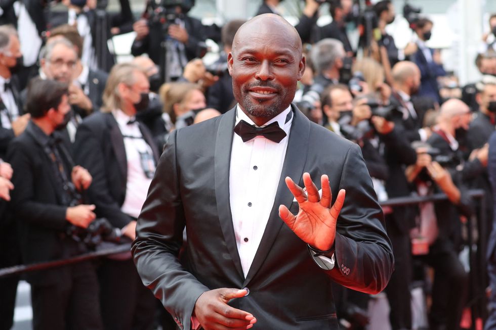 haitian actor jimmy jean louis waves as he arrives for the screening of the film the french dispatch at the 74th edition of the cannes film festival in cannes, southern france, on july 12, 2021 photo by valery hache  afp photo by valery hacheafp via getty images