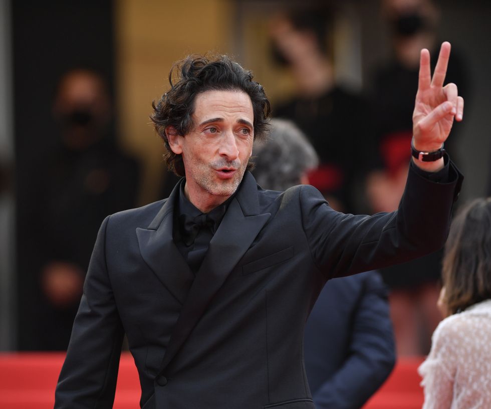 cannes, france   july 12 us actor adrien brody l and french music composer alexandre desplat r arrive for the screening of the film âthe french dispatch in competition at the 74th annual cannes film festival in cannes, france on july 12, 2021 photo by mustafa yalcinanadolu agency via getty images