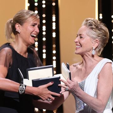 french director julia ducournau l reacts as receives the palme dor for her film titane from us actress sharon stone during the closing ceremony of the 74th edition of the cannes film festival in cannes, southern france, on july 17, 2021 photo by valery hache  afp photo by valery hacheafp via getty images