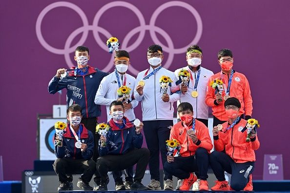 silver medallists taiwans deng yu cheng lower l, tang chih chun lower 2nd l and wei chun heng top l, gold medallists south koreas kim je deok top 2nd l, kim woo jin top c and oh jin hyek top 2nd r, bronze medallists japans takaharu furukawa top r, japans yuki kawata lower 2nd r and hiroki muto lower r pose on the podium during the mens team victory ceremony during the tokyo 2020 olympic games at yumenoshima park archery field in tokyo on july 26, 2021 photo by adek berry  afp photo by adek berryafp via getty images