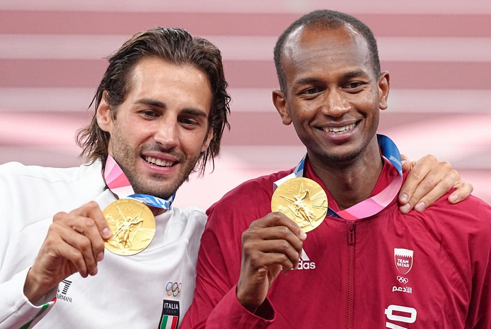 02 august 2021, japan, tokio athletics olympics, high jump, men, final, at the olympic stadium mutaz essa barshim r from qatar and gianmarco tamberi from italy stand together with their gold medals during the award ceremony photo michael kappelerdpa photo by michael kappelerpicture alliance via getty images