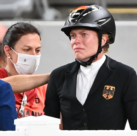06 august 2021, japan, tokio modern pentathlon olympics, individual, women, jumping at tokyo stadium annika schleu r of germany reacts behind her in the middle is national coach kim raisner m her horse had refused to jump several times photo marijan muratdpa photo by marijan muratpicture alliance via getty images