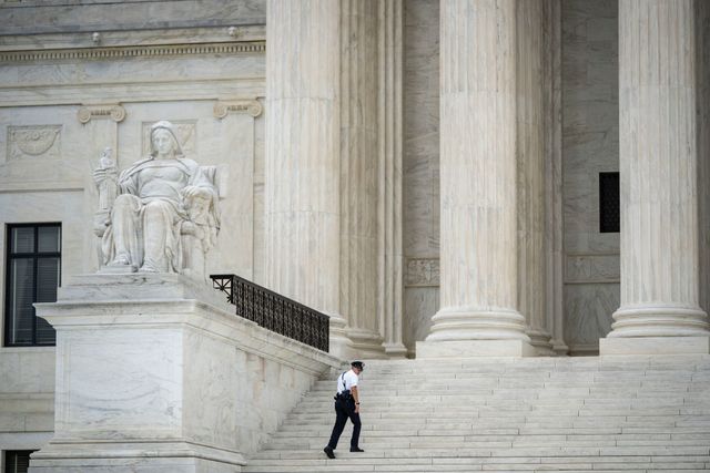 washington, dc   september 01 a supreme court police officer walks on the steps of the us supreme court on september 1, 2021 in washington, dc a new texas law that prohibits most abortions after six weeks of pregnancy went into effect on wednesday the us supreme court did not act on a request to block the law photo by drew angerergetty images