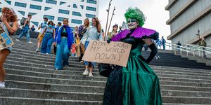 a drag queen is walking down the stairs with a placard in support of the climate, during the global climate strike organized in utrecht, on september 24th, 2021 photo by romy arroyo fernandeznurphoto