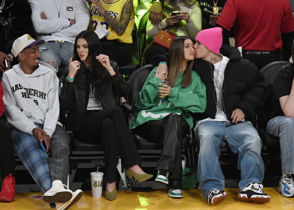 los angeles, ca   october 22 travis bennett, kendall jenner, hailey bieber and justin bieber attend the phoenix suns and los angeles lakers baseball game at staples center on october 22, 2021 in los angeles, california note to user user expressly acknowledges and agrees that, by downloading andor using this photograph, user is consenting to the terms and conditions of the getty images license agreement photo by kevork djanseziangetty images