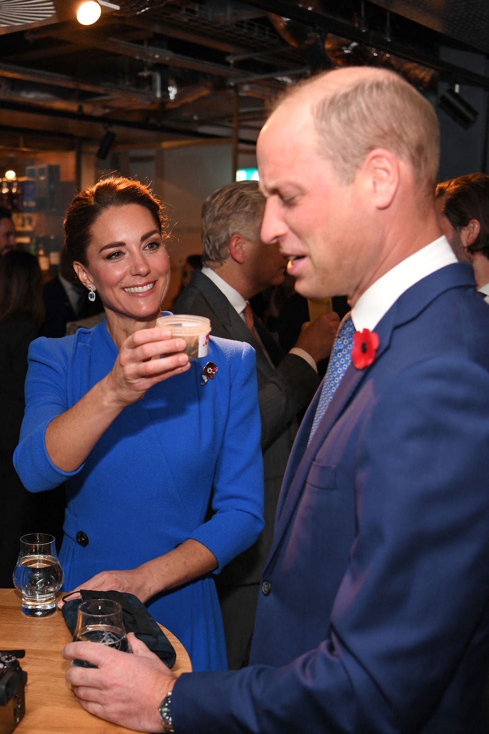 britains catherine, duchess of cambridge l offers a tub of dead larvae, used as livestock feed, to her husband britains prince william, duke of cambridge r while they speak with guests at a reception for the key members of the sustainable markets initiative and the winners and finalists of the first earthshot prize awards at the clydeside distillery, on the sidelines of the cop26 un climate change conference in glasgow, scotland on november 1, 2021   cop26, running from october 31 to november 12 in glasgow will be the biggest climate conference since the 2015 paris summit and is seen as crucial in setting worldwide emission targets to slow global warming, as well as firming up other key commitments photo by daniel leal olivas  pool  afp photo by daniel leal olivaspoolafp via getty images