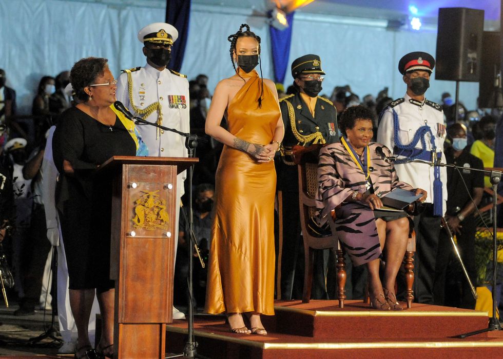 barbadoss prime minister mia mottley l asks the countrys new president sandra mason seated r to make barbadian singer rihanna c the countrys 11th national hero during a ceremony to declare barbados a republic and the inauguration of the countrys first president, at heroes square in bridgetown on november 30, 2021 photo by randy brooks  afp photo by randy brooksafp via getty images