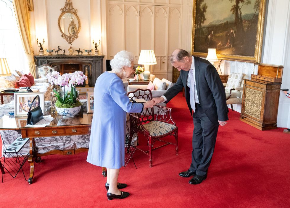britains queen elizabeth ii presents english concert organist thomas trotter with the queens medal for music, during an audience at windsor castle, west of london on december 8, 2021 photo by dominic lipinski  pool  afp photo by dominic lipinskipoolafp via getty images