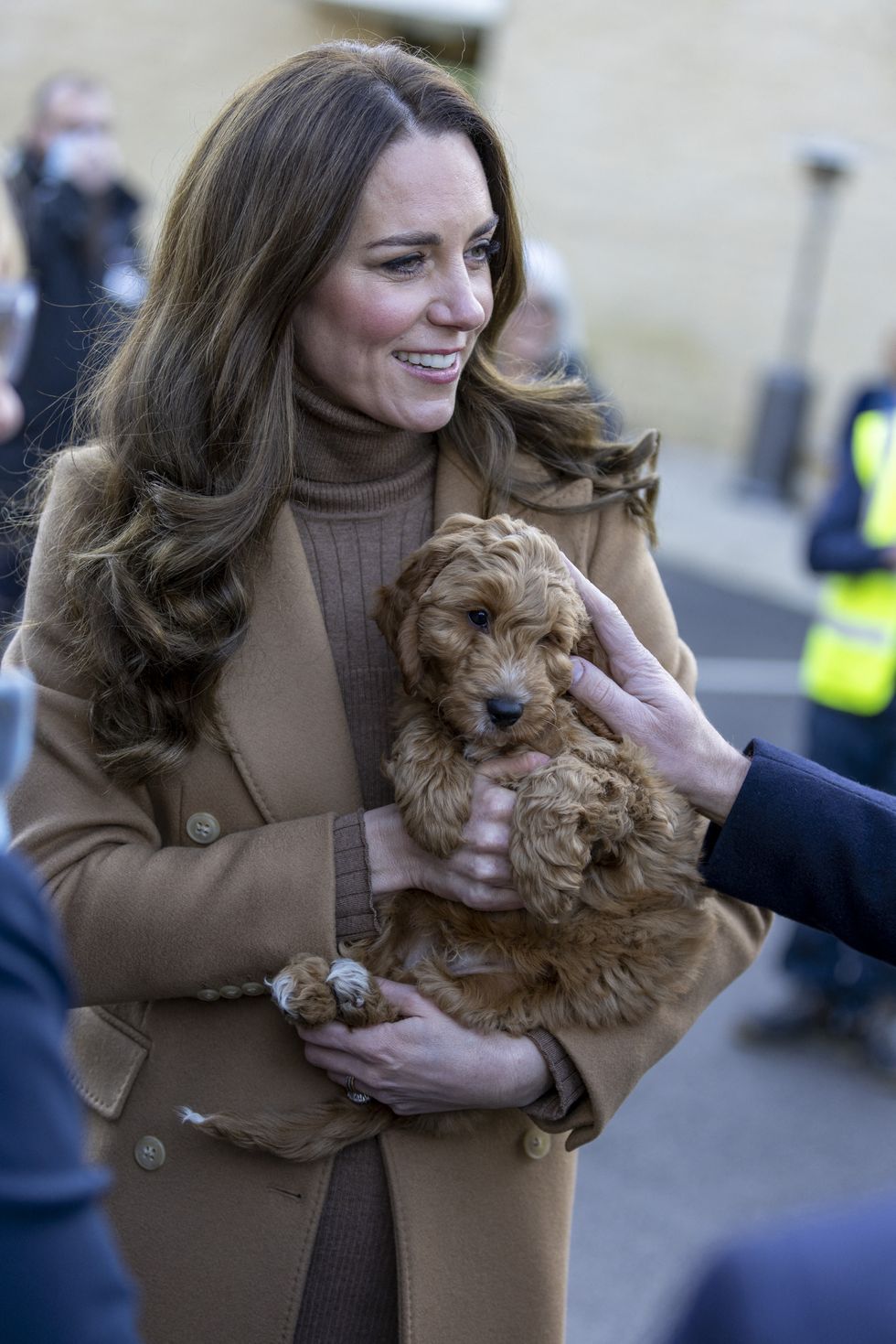 britains catherine, duchess of cambridge, holds a therapy puppy, before unveiling its name, alfie, to members of staff during her visit to clitheroe community hospital in north east england on january 20, 2022, to hear about their experiences during the covid 19 pandemic   the puppy, funded through the hospital charity elhtme using a grant from nhs charities together, will be used to support the wellbeing of staff and patients at the hospital photo by james glossop  pool  afp photo by james glossoppoolafp via getty images
