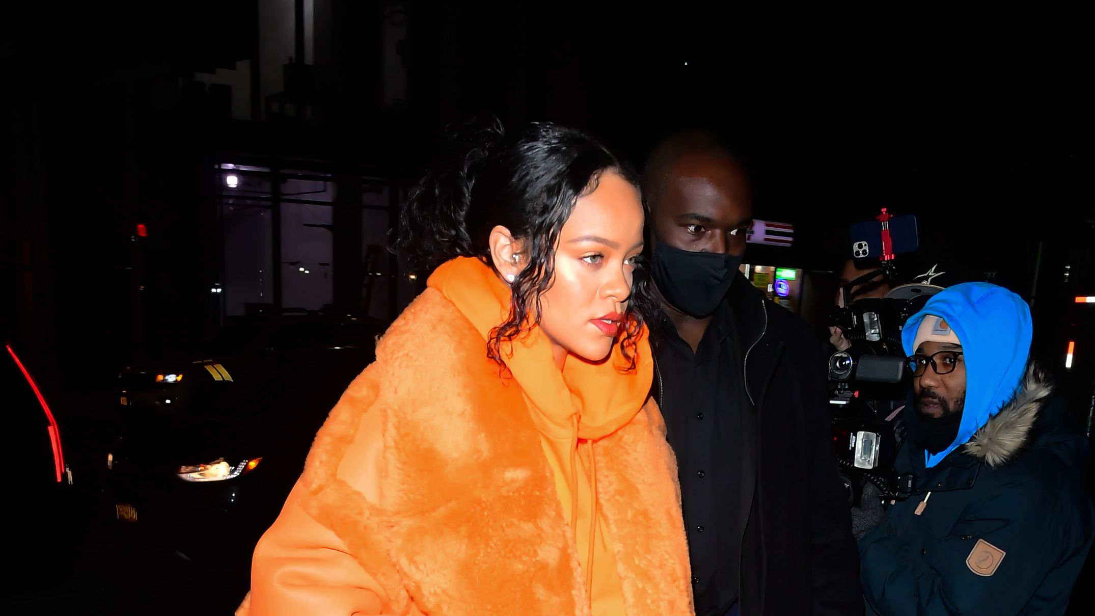See Rihanna Pair a Bright-Orange Coat with Camo Pants